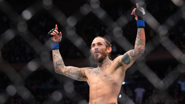 Nov 6, 2021; New York, NY, USA; Marlon Vera (blue gloves) celebrates after defeating Frankie Edgar (red gloves) during UFC 268 at Madison Square Garden.
